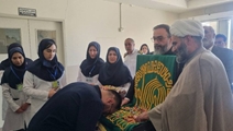 پنجره‌ای به سوی بهشت، اهتزاز پرچم امام رضا (ع) در بیمارستان امام خمینی (ره) شهرستان آباده